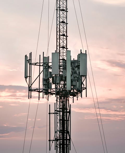 Telecommunication towers with a background atmosphere, evening sky 480x585